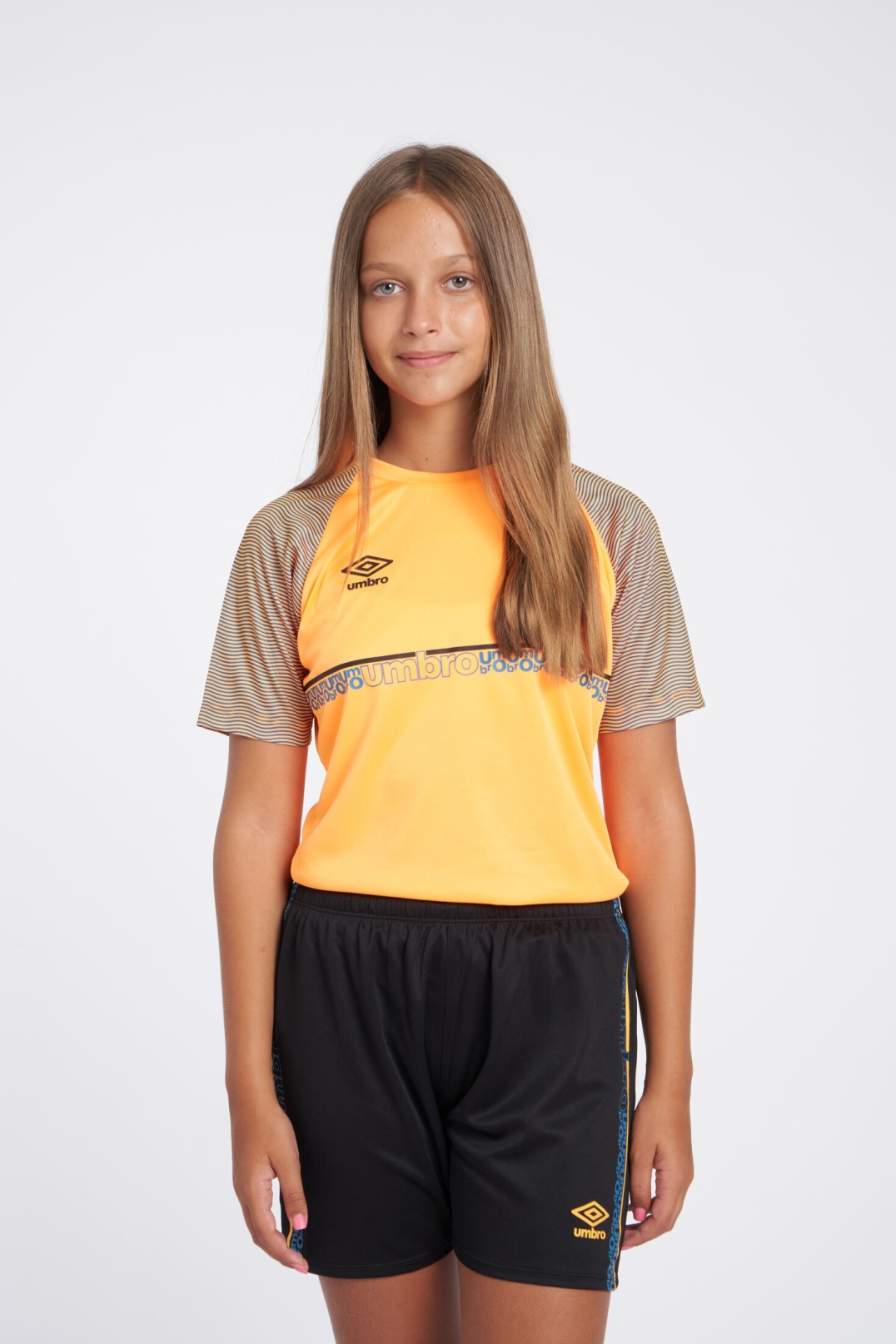 CAMISETA UMBRO SPIRITO JERSEY - JNR ORANGE POP / BLACK / PETROL BLUE